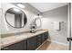 Bathroom with double sinks, granite countertops and modern fixtures at 2107 E Park Ave, Gilbert, AZ 85234