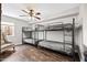 Bedroom with industrial-style bunk beds, offering ample sleeping space and unique design at 2107 E Park Ave, Gilbert, AZ 85234