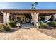 Inviting covered patio with decorative plants, string lights, and elegant decor perfect for outdoor entertaining at 2107 E Park Ave, Gilbert, AZ 85234