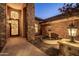 Charming front entrance with a unique iron door and water fountain feature at 2107 E Park Ave, Gilbert, AZ 85234