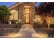 Close up of an impressive front entrance with iron door and arched window at 2107 E Park Ave, Gilbert, AZ 85234