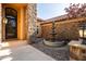 Elegant stone entrance with a custom door, fountain, and manicured landscaping at 2107 E Park Ave, Gilbert, AZ 85234