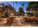 Landscaped walkway with ambient lighting leading to the house at 2107 E Park Ave, Gilbert, AZ 85234
