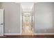 Hallway featuring tile flooring leading to a luxury bathtub with windows at 2107 E Park Ave, Gilbert, AZ 85234
