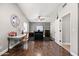 Bright living room with hardwood floors and a high ceiling and a black and white accent wall at 2107 E Park Ave, Gilbert, AZ 85234
