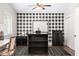 Spacious living room with hardwood floors, a high ceiling, and a black and white accent wall at 2107 E Park Ave, Gilbert, AZ 85234