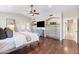 Well-lit bedroom with hardwood floors, a ceiling fan, and built-in storage at 2107 E Park Ave, Gilbert, AZ 85234