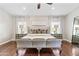 Spacious bedroom featuring a statement bed, hardwood floors, and neutral decor at 2107 E Park Ave, Gilbert, AZ 85234