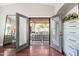 French doors open onto a charming outdoor living space, perfect for entertaining at 2107 E Park Ave, Gilbert, AZ 85234