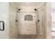 Tiled shower with dual shower heads and a built-in niche at 2107 E Park Ave, Gilbert, AZ 85234