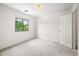Bright bedroom with a large window offering natural light and a spacious feel at 2327 E Meadow Creek Way, San Tan Valley, AZ 85140