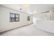 Bright bonus room featuring a window and neutral walls, perfect for flexible living at 2327 E Meadow Creek Way, San Tan Valley, AZ 85140