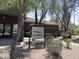 Meadow Vista Clubhouse & Pool Complex sign with well maintained shrubs and desert landscaping at 2327 E Meadow Creek Way, San Tan Valley, AZ 85140