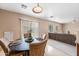Open dining area with backyard views, seating for four, and easy access to the living room at 2327 E Meadow Creek Way, San Tan Valley, AZ 85140