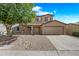 Charming two-story home with neutral color, well-manicured landscaping, and a two-car garage at 2327 E Meadow Creek Way, San Tan Valley, AZ 85140