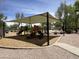 Neighborhood playground featuring colorful play structures and shaded seating at 2327 E Meadow Creek Way, San Tan Valley, AZ 85140