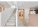 Carpeted staircase with white risers and walls leading to the upper level of the home at 2327 E Meadow Creek Way, San Tan Valley, AZ 85140