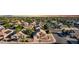 Overhead shot of a desert community featuring well maintained homes, desert landscaping and tree lined streets at 2343 E Morelos St, Chandler, AZ 85225