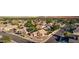 Aerial view of a lush, green residential community showcasing many homes and mature trees and shrubbery at 2343 E Morelos St, Chandler, AZ 85225