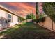 Large backyard with well-maintained lawn, mature trees, and a privacy fence at 2343 E Morelos St, Chandler, AZ 85225