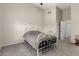 Comfortable bedroom with neutral carpeting, a large window, and door leading to other rooms at 2343 E Morelos St, Chandler, AZ 85225