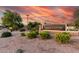 Kempton Crossing community sign amidst mature trees, decorative landscaping, and beautiful sunset skies at 2343 E Morelos St, Chandler, AZ 85225