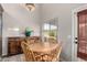 Cozy dining area with a round wood table, perfect for casual meals and gatherings at 2343 E Morelos St, Chandler, AZ 85225