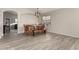 Open-concept dining room featuring modern wood-look floors and neutral paint at 2343 E Morelos St, Chandler, AZ 85225