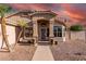 Inviting single-story home entrance with desert landscaping, potted flowers, and a charming front door at 2343 E Morelos St, Chandler, AZ 85225