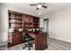 Home office space featuring built-in bookshelves and a desk at 2343 E Morelos St, Chandler, AZ 85225