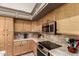 Functional kitchen with stainless steel appliances, granite countertops, and tile backsplash at 2343 E Morelos St, Chandler, AZ 85225