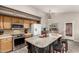 Spacious kitchen island with seating, offering additional prep space and casual dining options at 2343 E Morelos St, Chandler, AZ 85225