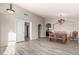 Spacious open-concept living space featuring wood-look floors and seamless transitions at 2343 E Morelos St, Chandler, AZ 85225