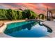 Gorgeous backyard pool featuring lush landscaping, patio seating, and serene ambiance at 2343 E Morelos St, Chandler, AZ 85225