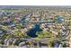 Stunning aerial view of the lake community with beautiful homes and lush landscaping at 2421 W Indigo Dr, Chandler, AZ 85248