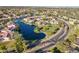 Overhead view featuring the community's serene lake, meticulously designed streets, and landscaping at 2421 W Indigo Dr, Chandler, AZ 85248