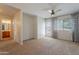 Spacious bedroom with en suite bathroom, ceiling fan, and access to private balcony at 2421 W Indigo Dr, Chandler, AZ 85248
