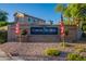 Inviting Corona Del Mar at Ocotillo community sign with manicured landscaping and American flags at 2421 W Indigo Dr, Chandler, AZ 85248