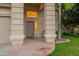Inviting front entrance with stone accents, a covered porch, and a well-maintained lawn at 2421 W Indigo Dr, Chandler, AZ 85248