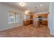 Well-lit kitchen featuring wood cabinets, stainless steel appliances, and a center island at 2421 W Indigo Dr, Chandler, AZ 85248