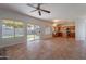 Open-concept floor plan with tile floors connecting the living room and kitchen at 2421 W Indigo Dr, Chandler, AZ 85248