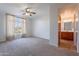 Large main bedroom features en suite bathroom and large window with view at 2421 W Indigo Dr, Chandler, AZ 85248