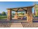 Covered picnic area with a table and grill, perfect for outdoor gatherings and relaxation at 2421 W Indigo Dr, Chandler, AZ 85248