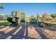 Community playground with various play structures, slide, and climbing features at 2421 W Indigo Dr, Chandler, AZ 85248