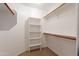 Walk-in closet features carpet and shelving for optimal organization at 2421 W Indigo Dr, Chandler, AZ 85248