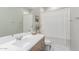 Bright bathroom showcasing a white countertop, modern faucet, and shower with a stylish curtain at 2499 S Entwistle St, Gilbert, AZ 85295