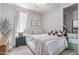 Cozy bedroom featuring a comfortable bed, bedside table, and closet, creating a peaceful retreat at 2499 S Entwistle St, Gilbert, AZ 85295