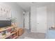 Spacious bedroom with decorated walls and multiple access doors at 2499 S Entwistle St, Gilbert, AZ 85295