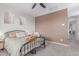 Comfortable bedroom showcasing soft carpet, a ceiling fan, and a painted accent wall at 2499 S Entwistle St, Gilbert, AZ 85295