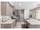 Open-concept kitchen featuring stainless steel appliances, and ample counter space for cooking at 2499 S Entwistle St, Gilbert, AZ 85295